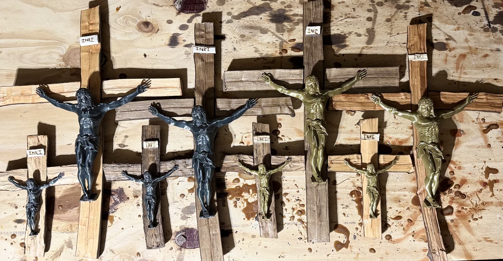 A collection of handmade branch crucifixes for a gift shop display